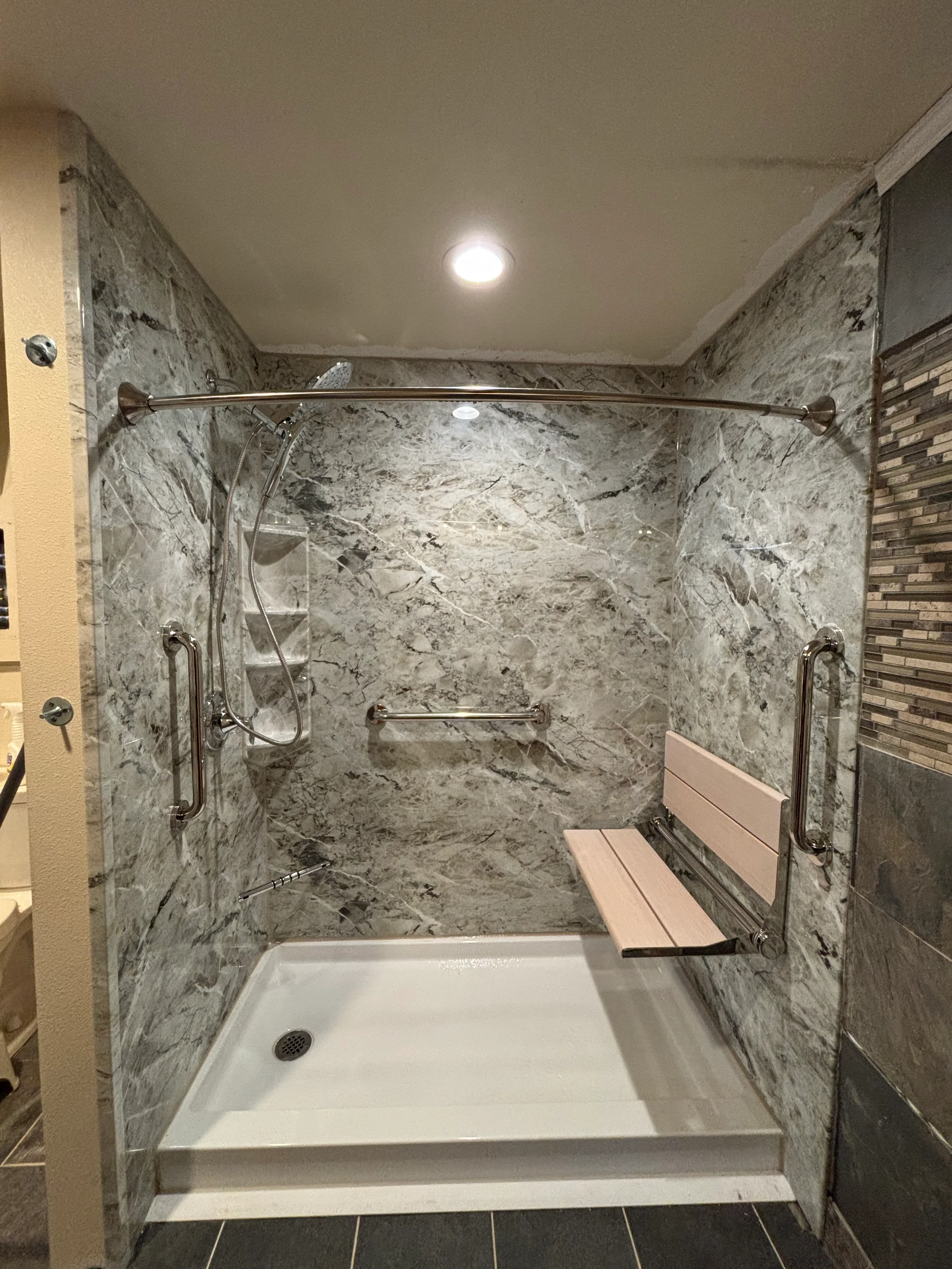 Modern bathroom with custom tile shower and vanity